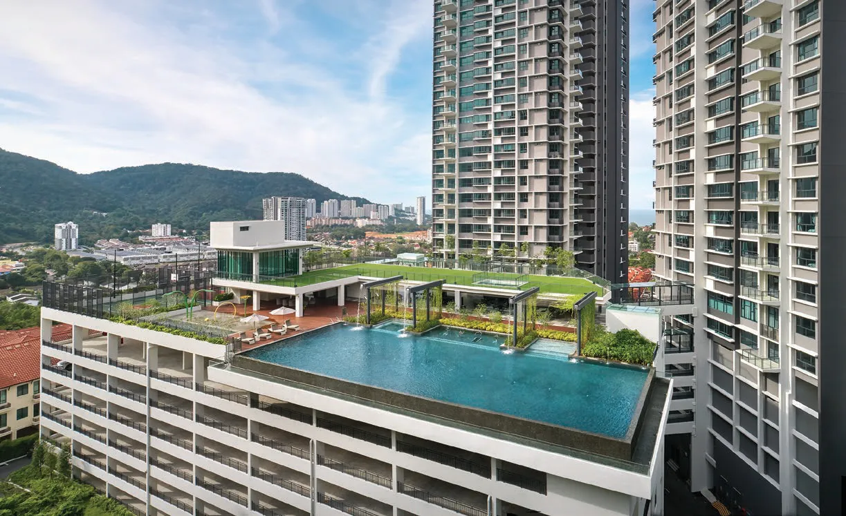 Alila 2, Tanjung Bungah, Penang: podium pool and rooftop pavilion with Penang Hill behind, actual photo