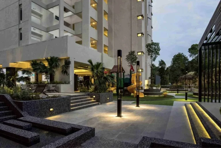 Mont Residence, Mount Erskine: landscaped facilities deck at the foot of the towers at dusk